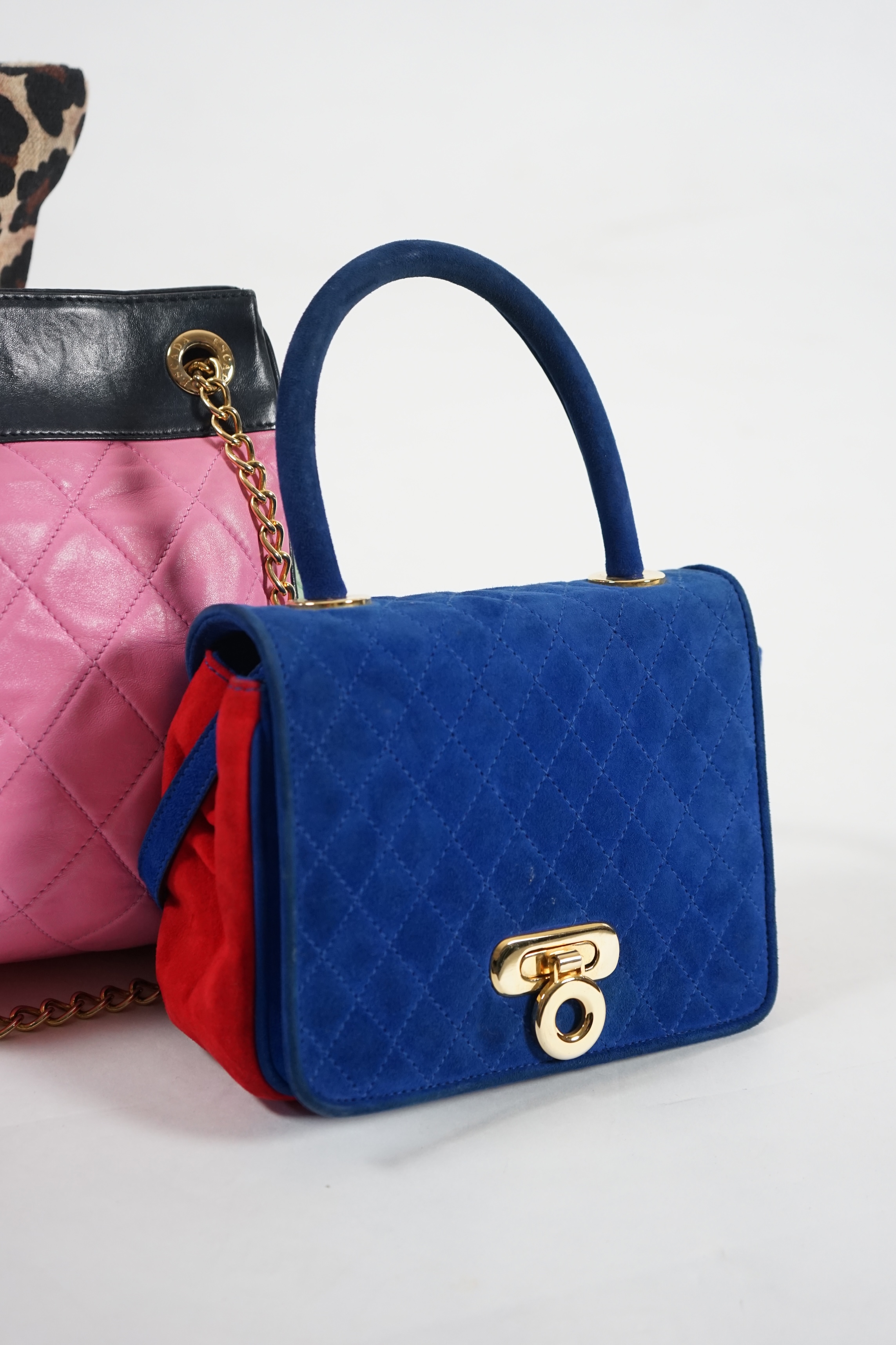 A selection of lady's handbags, including an animal print Stuart Weitzman shoulder bag with dust bag, an Escada suede royal blue and red shoulder bag, and another Escada handbag in navy blue with pink and light green qui
